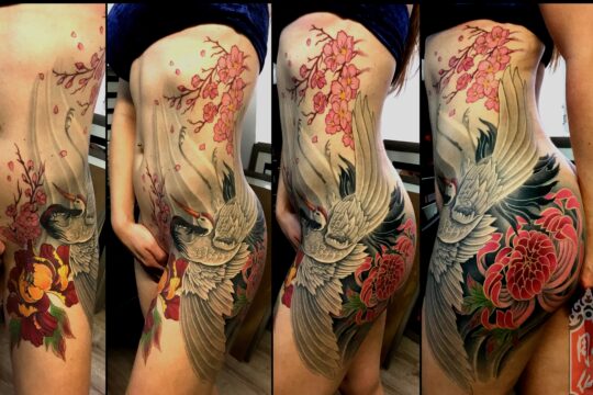 Tatouage japonais d'oiseau et de fleurs de cerisier réalisé par un tatoueur à Aix-en-Provence