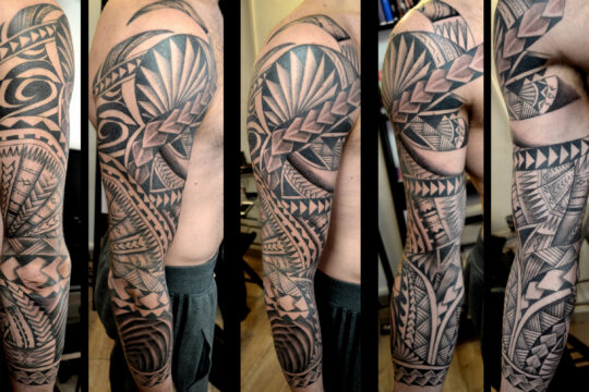 Tatouage maori sur le bras réalisé par un tatoueur à Aix-en-Provence